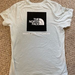 light blue North face graphic tee